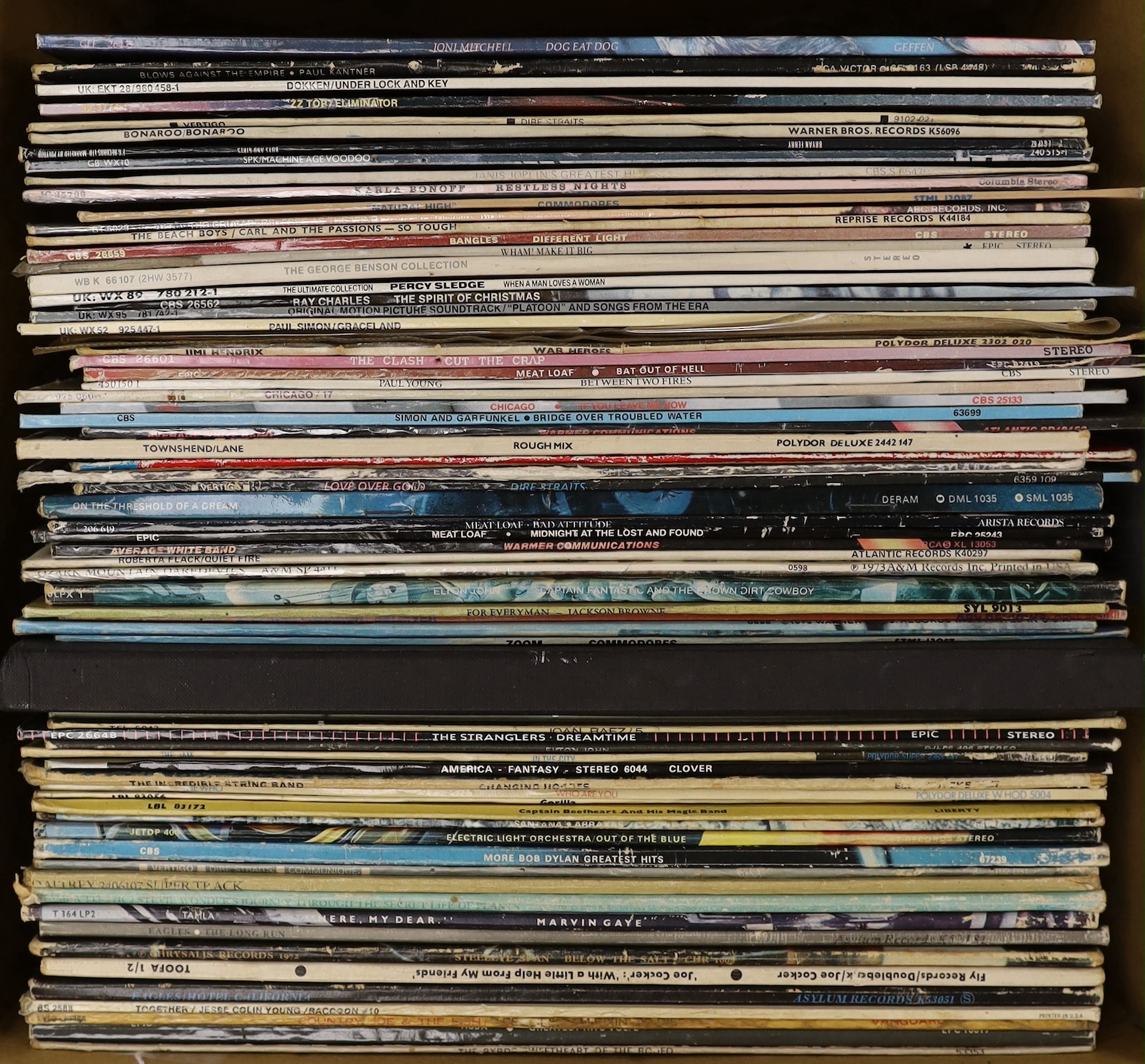 Sixty-nine LP record albums, by artists including; The Beach Boys, George Benson, Paul Simon, The Clash, Meat Loaf, Average White Band, Dire Straits, Elton John, ELO, Eagles, Joe Cocker, etc.